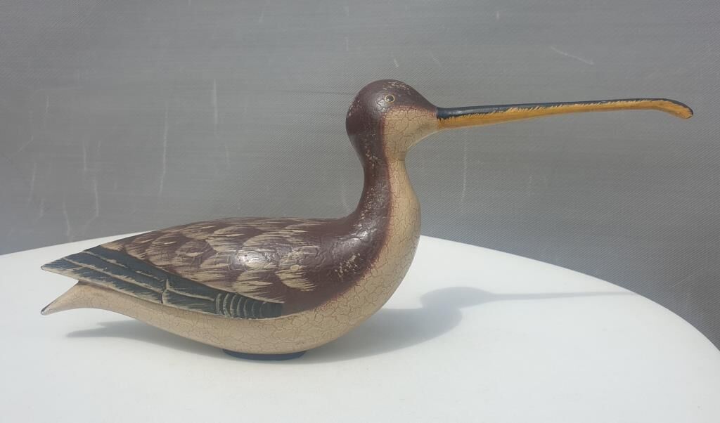 Carved painted wooden curlew