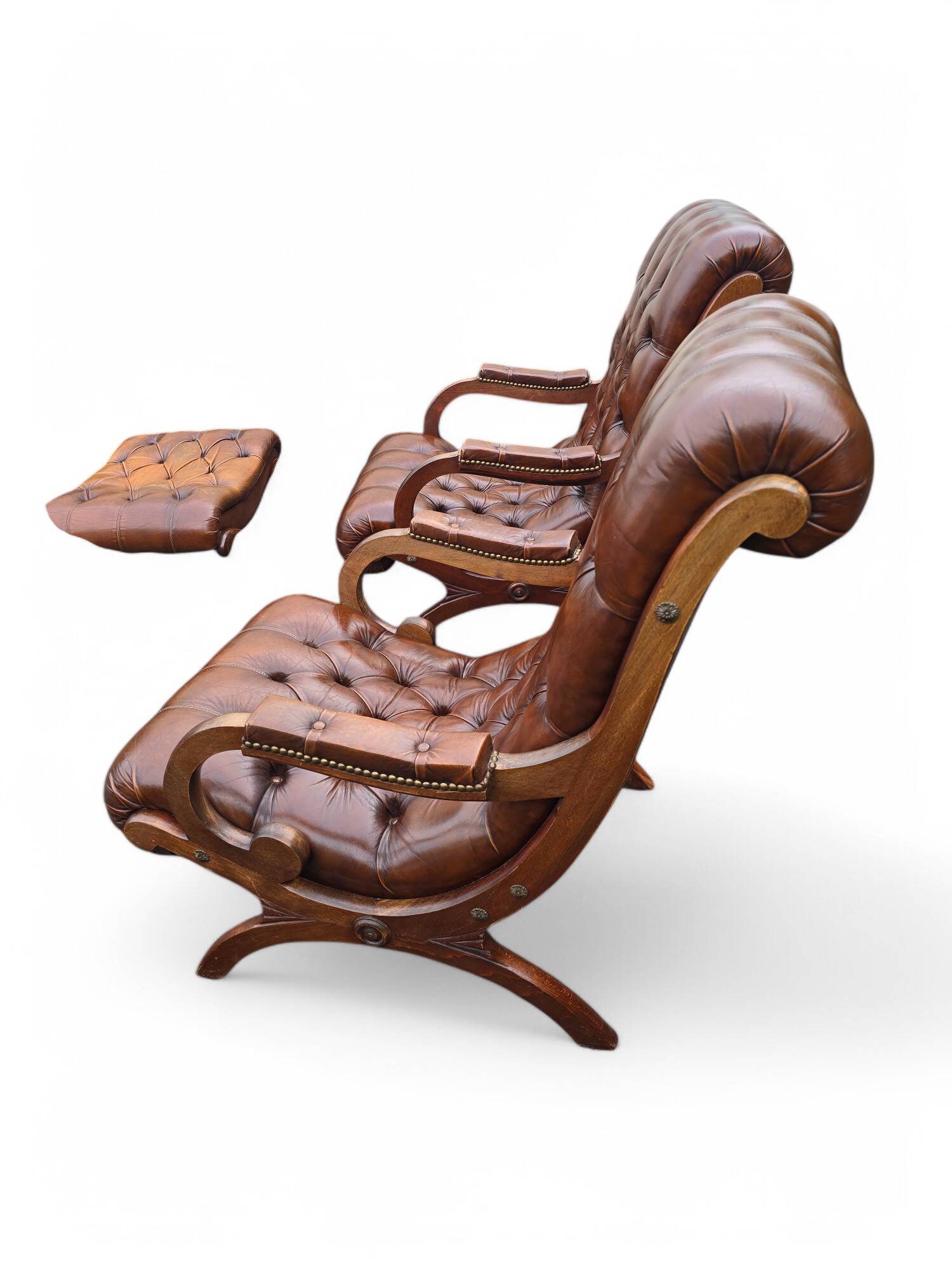 Pair of leather Chesterfields and footstools