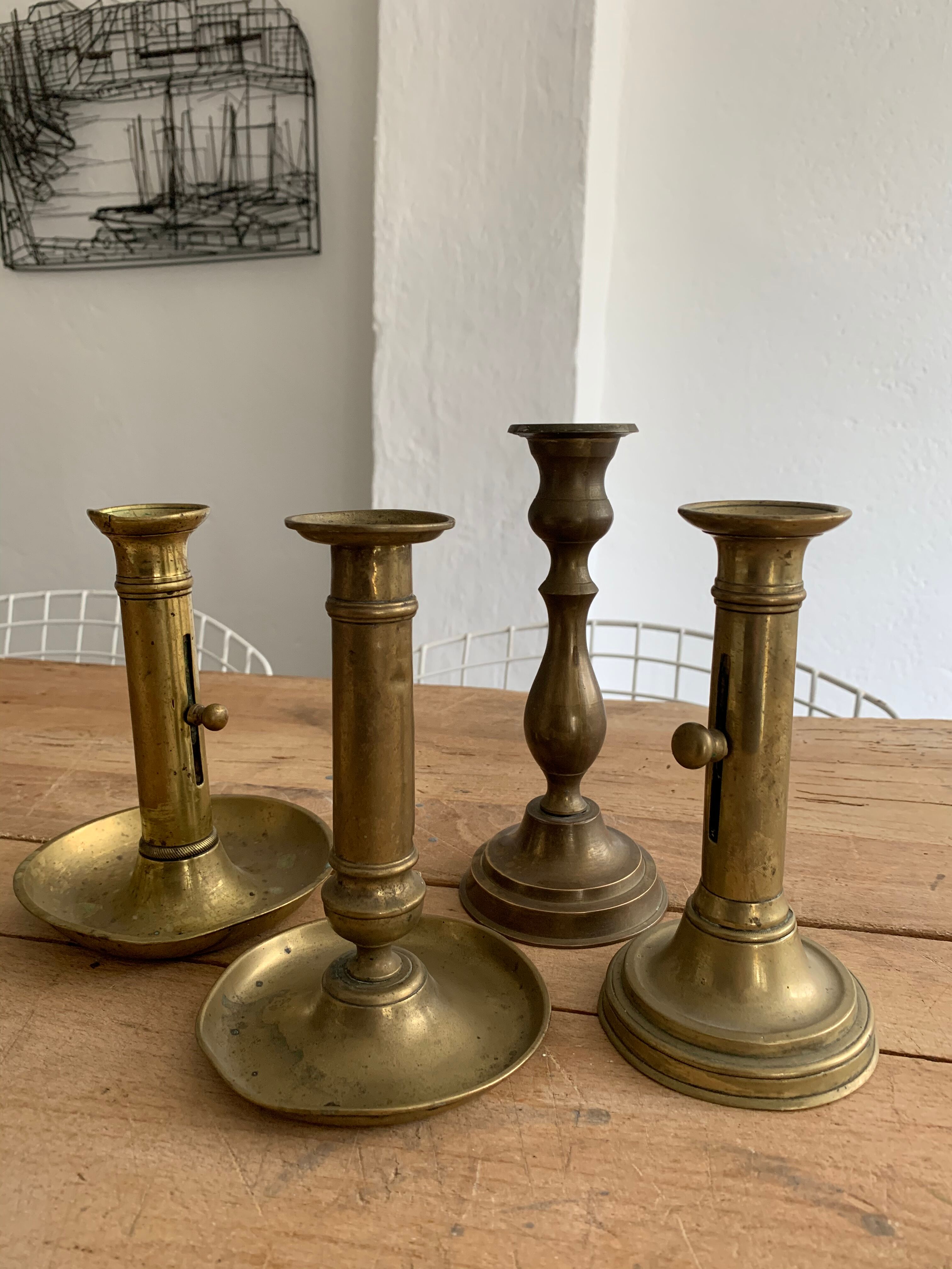 Set 4 vintage brass candlesticks patinated