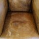 Fauteuil ancien en cuir de mouton
