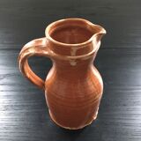 Signed pitcher in yellow ochre sandstone