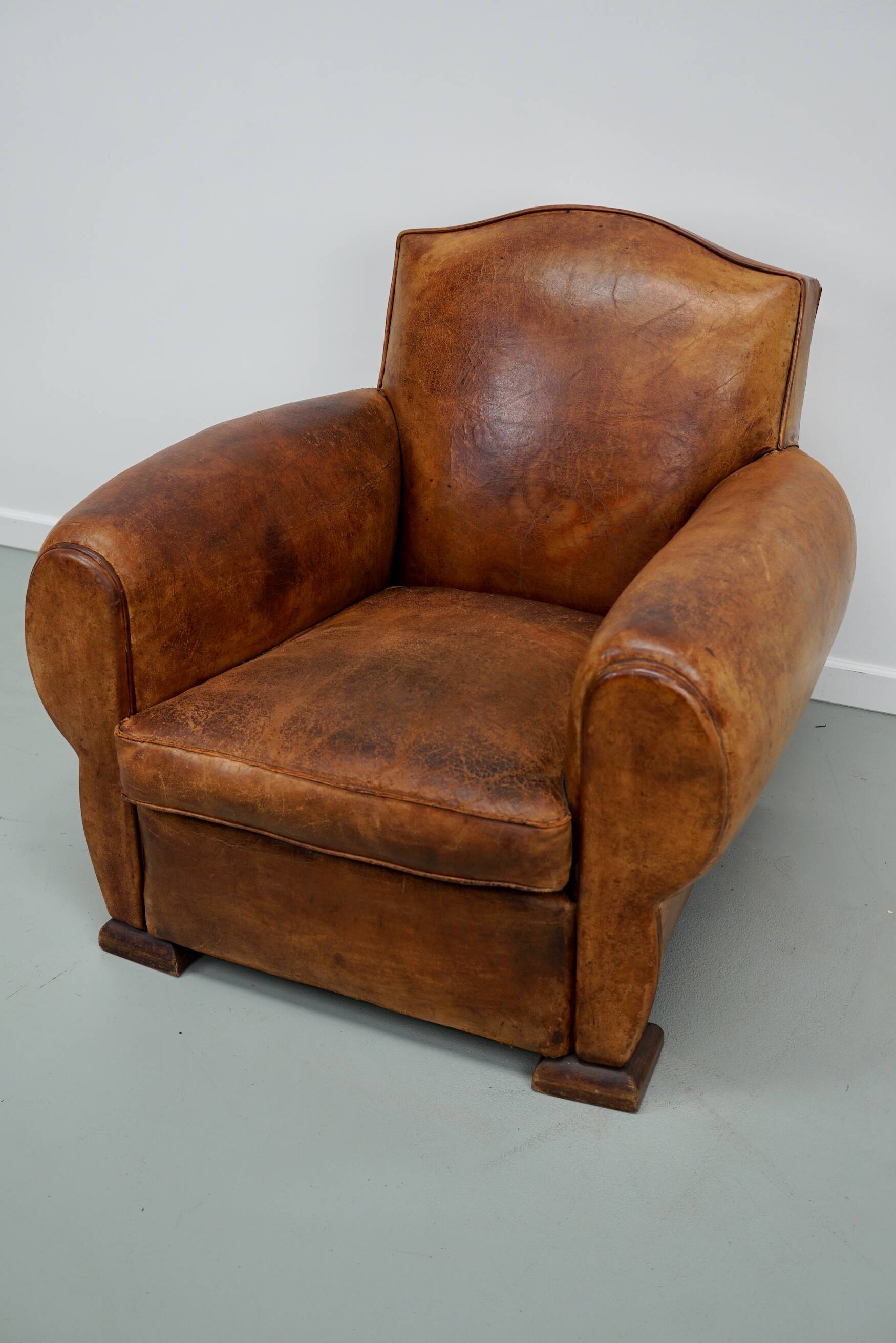 French moustache back cognac-colored leather club chair, 1940s