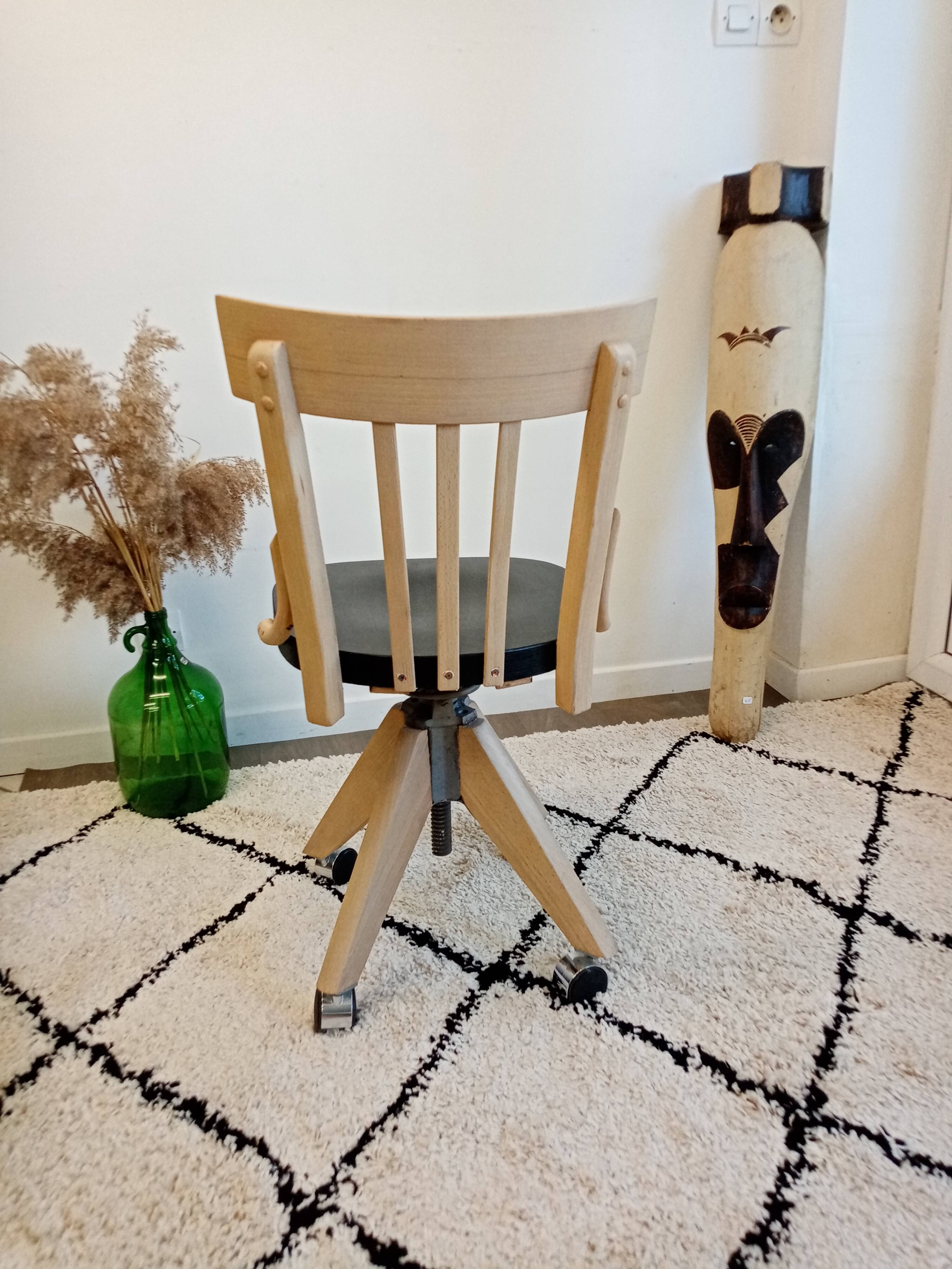 Black and wood workshop chair with metal base
