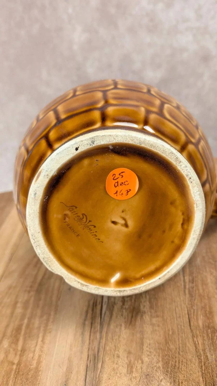 Vintage Sarreguemines pitcher with brown relief decoration.