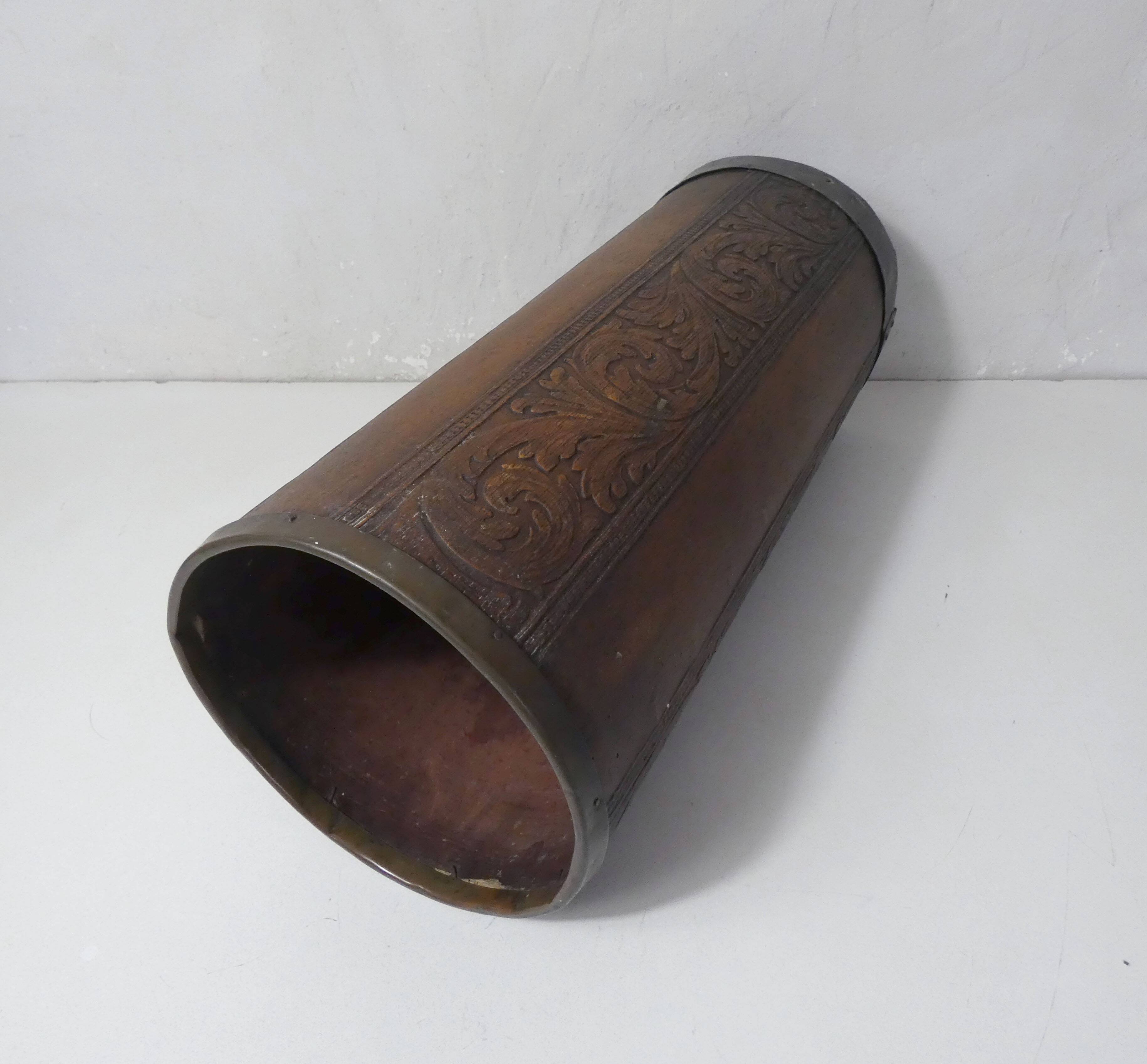 old carved wooden umbrella stand