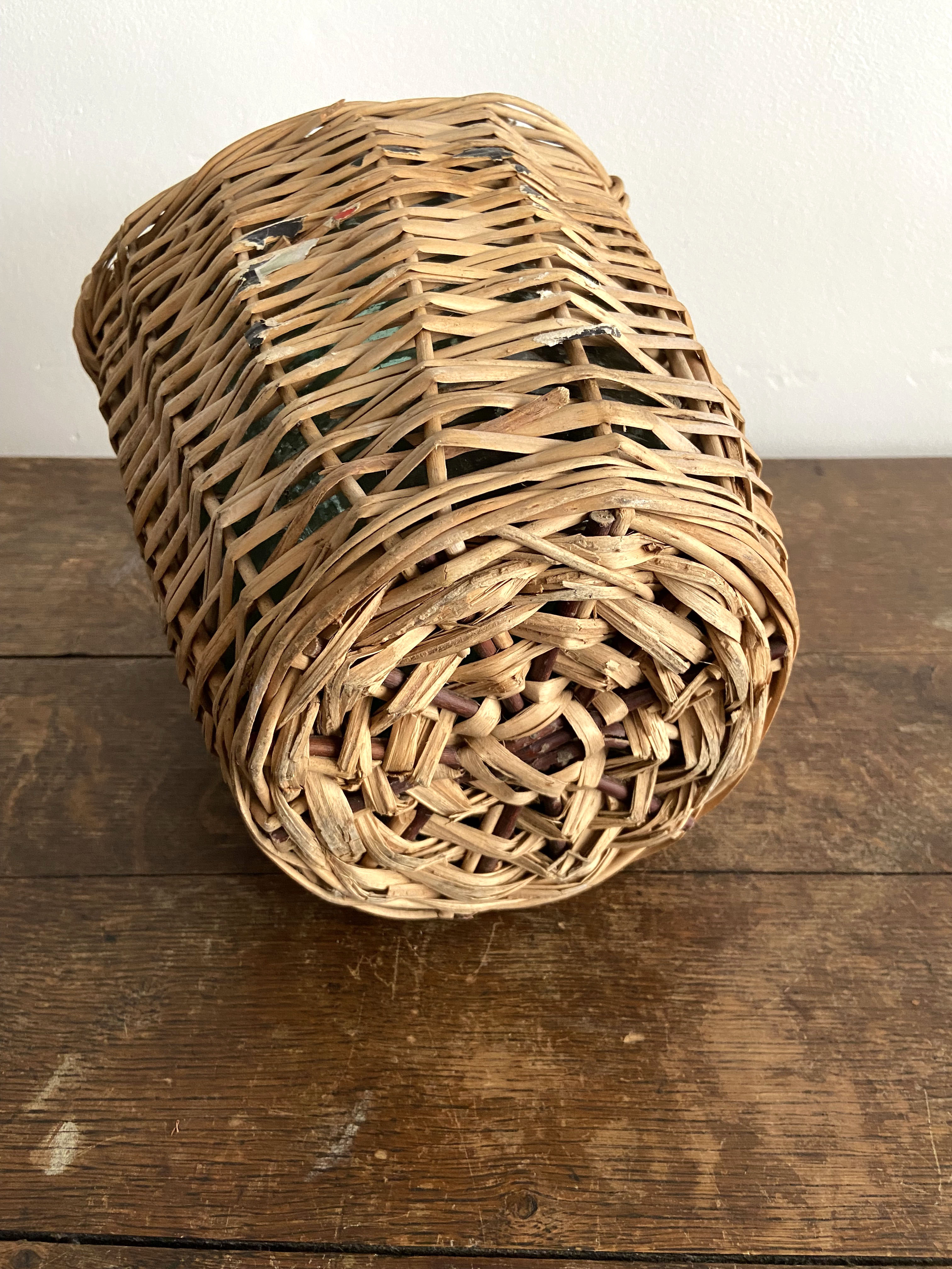 Demijohn surrounded by wicker