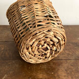 Demijohn surrounded by wicker