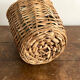 Demijohn surrounded by wicker
