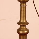bronze candlestick from the 17th century converted into a lamp with its lampshade