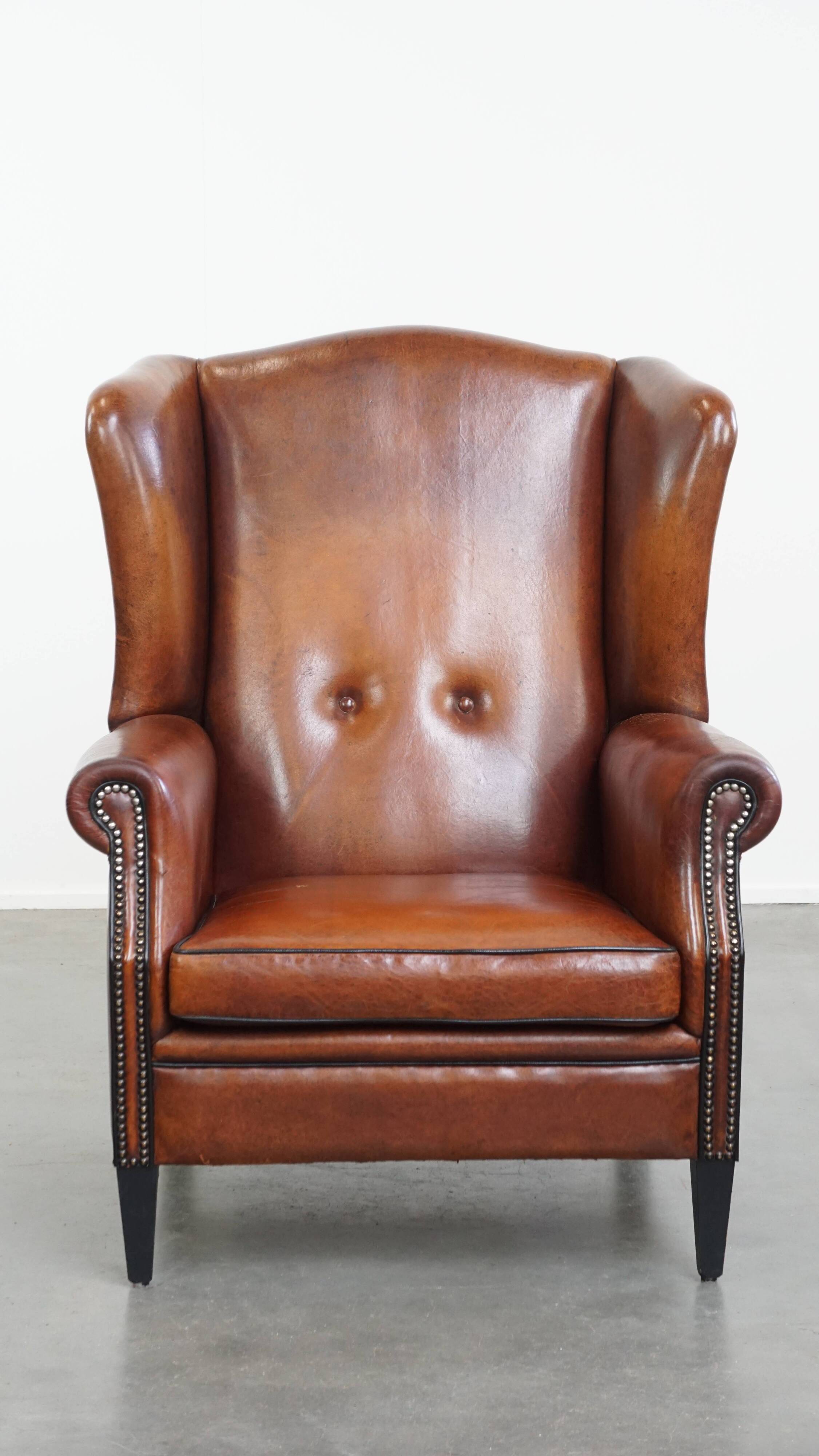 Sheepskin Wingback Chair with Warm Tones and Black Piping