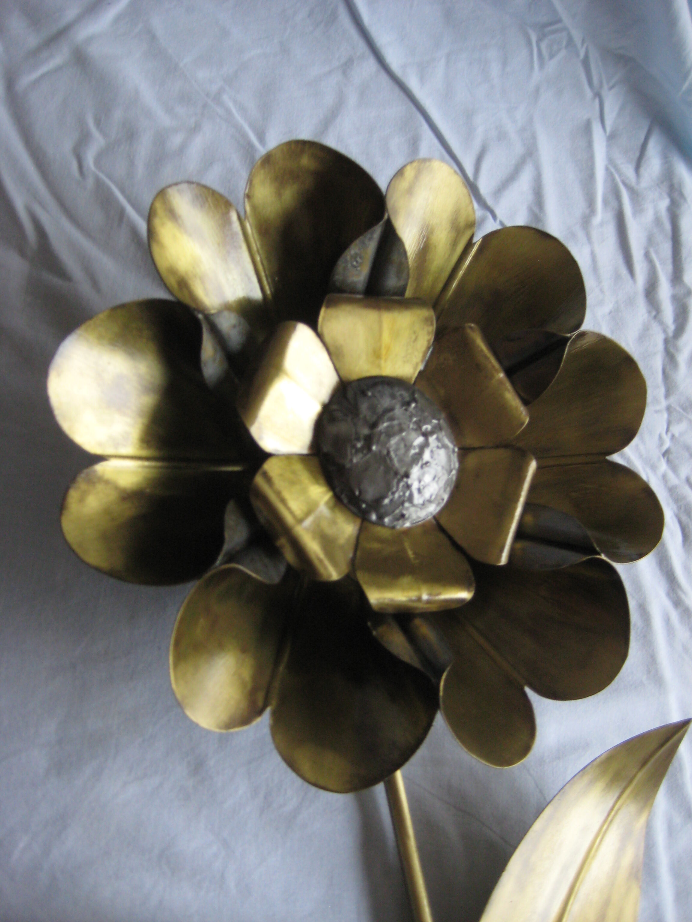 Brass sunflower sconces