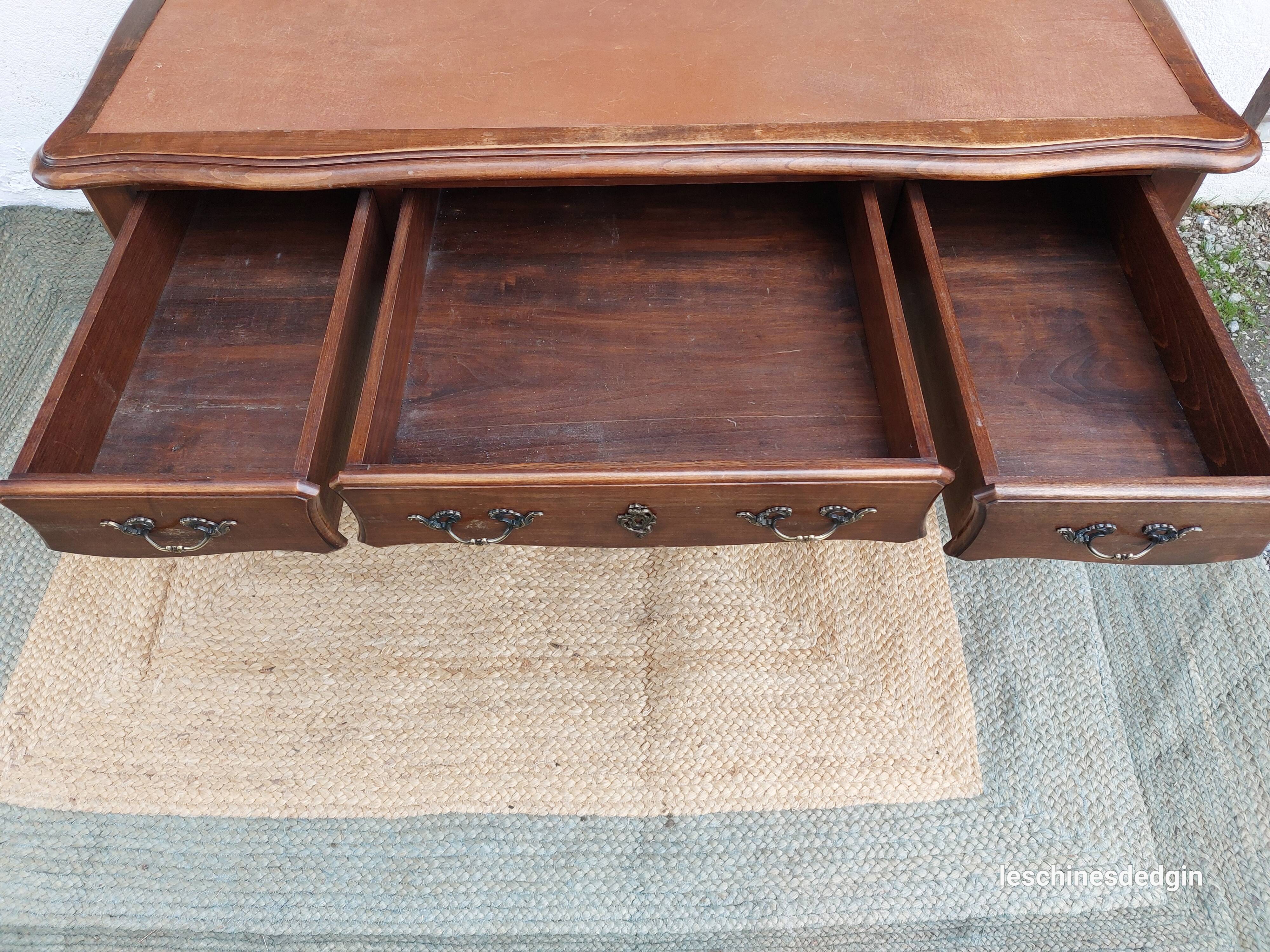 Louis XV style desk in wood, with a brown leather top.