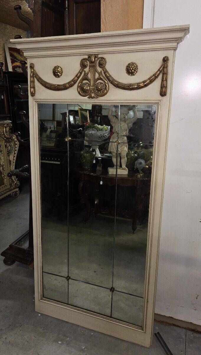 Louis XVI style trumeau mirror with a painted wooden frame.
