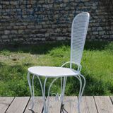 Two small wrought iron chairs