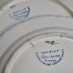 Pair of Henriot Quimper plates decorated with flower, 24 cm