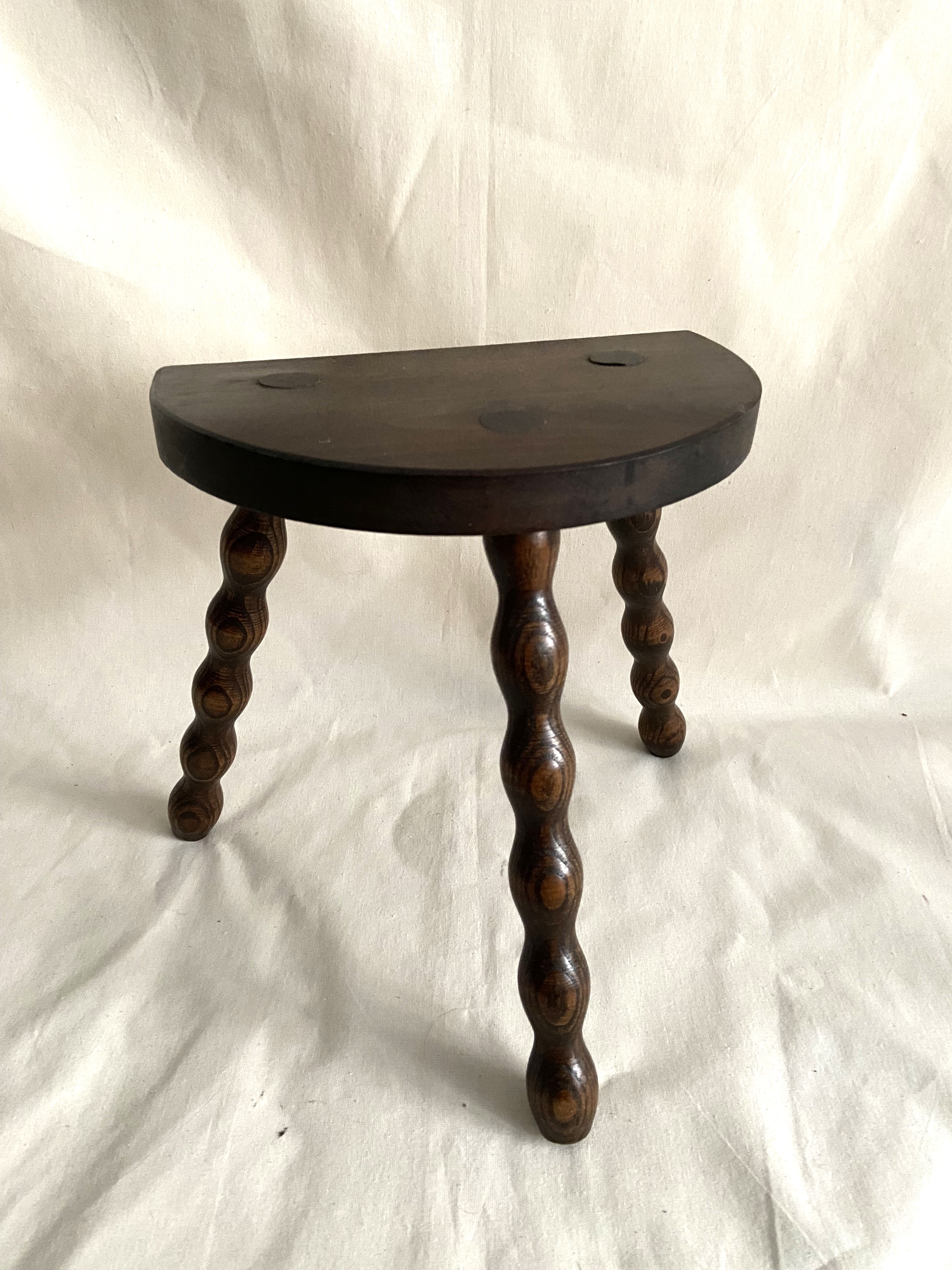 Tripod stool in turned wood