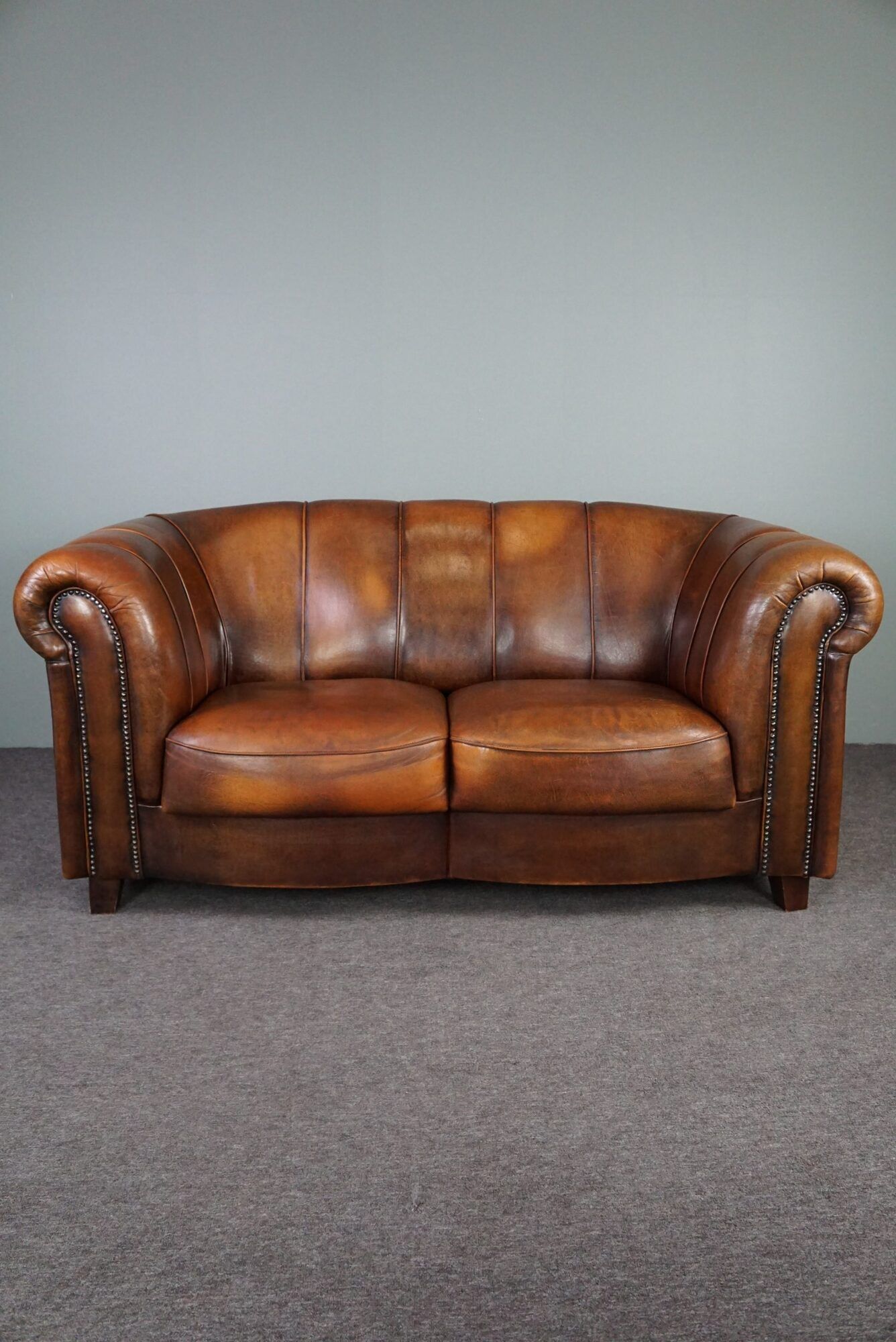 Beautiful sheep leather set of two club chairs and a 2 seater sofa