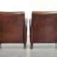 Dark cognac-coloured set of 2 sheepskin armchairs with a sleek design