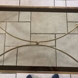 Coffee table in glass and gold metal