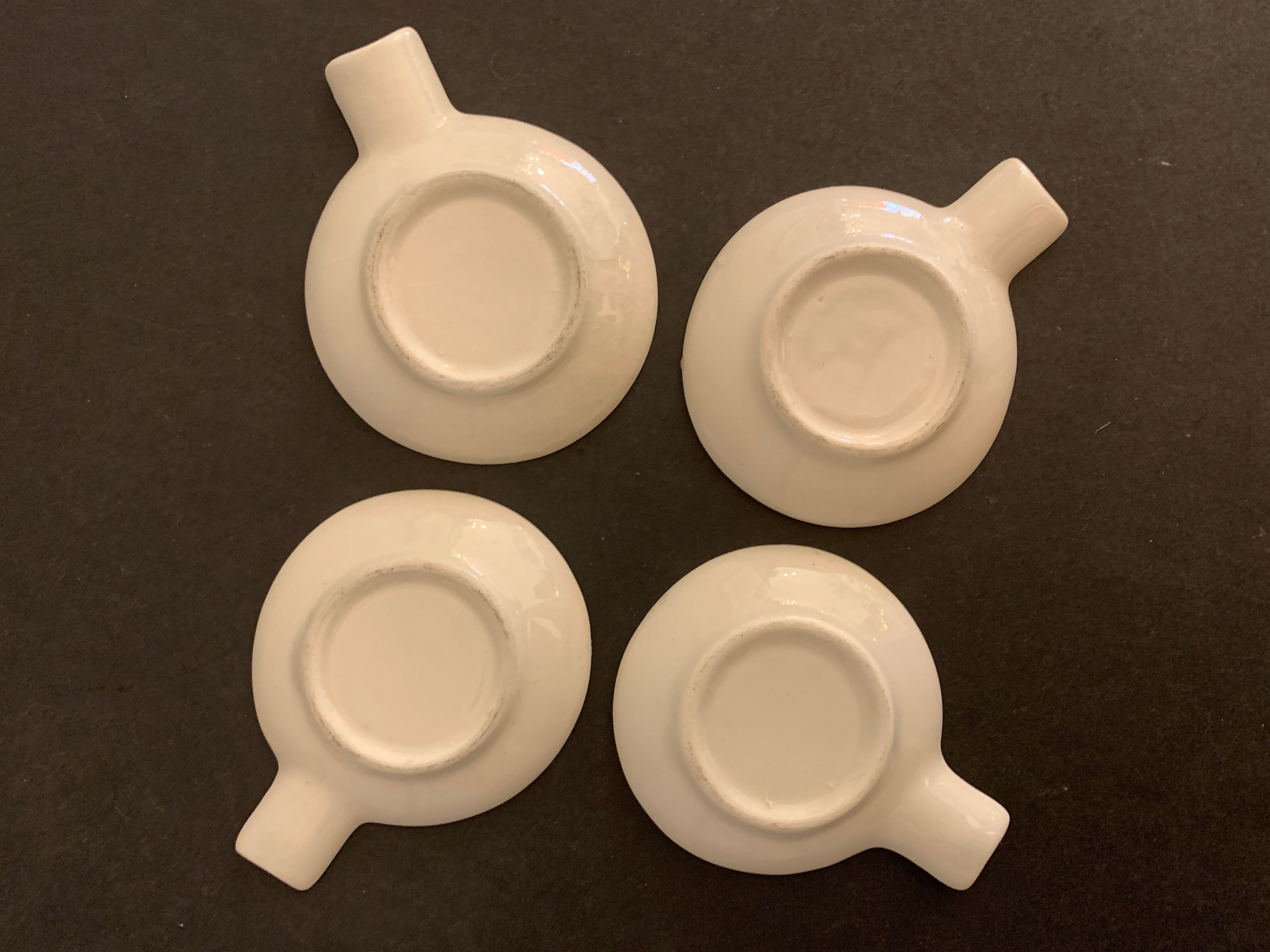 4 individual Italian ceramic stackable ashtrays with women's faces