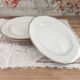 Set of 6 flat plates in fine white Bohemian porcelain with a gold rim.