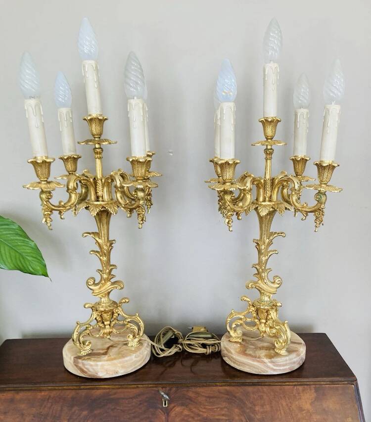 Pair of gilt bronze chandeliers, marble bases.