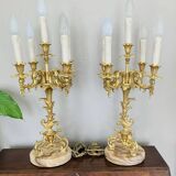 Pair of gilded bronze candlesticks, marble bases.