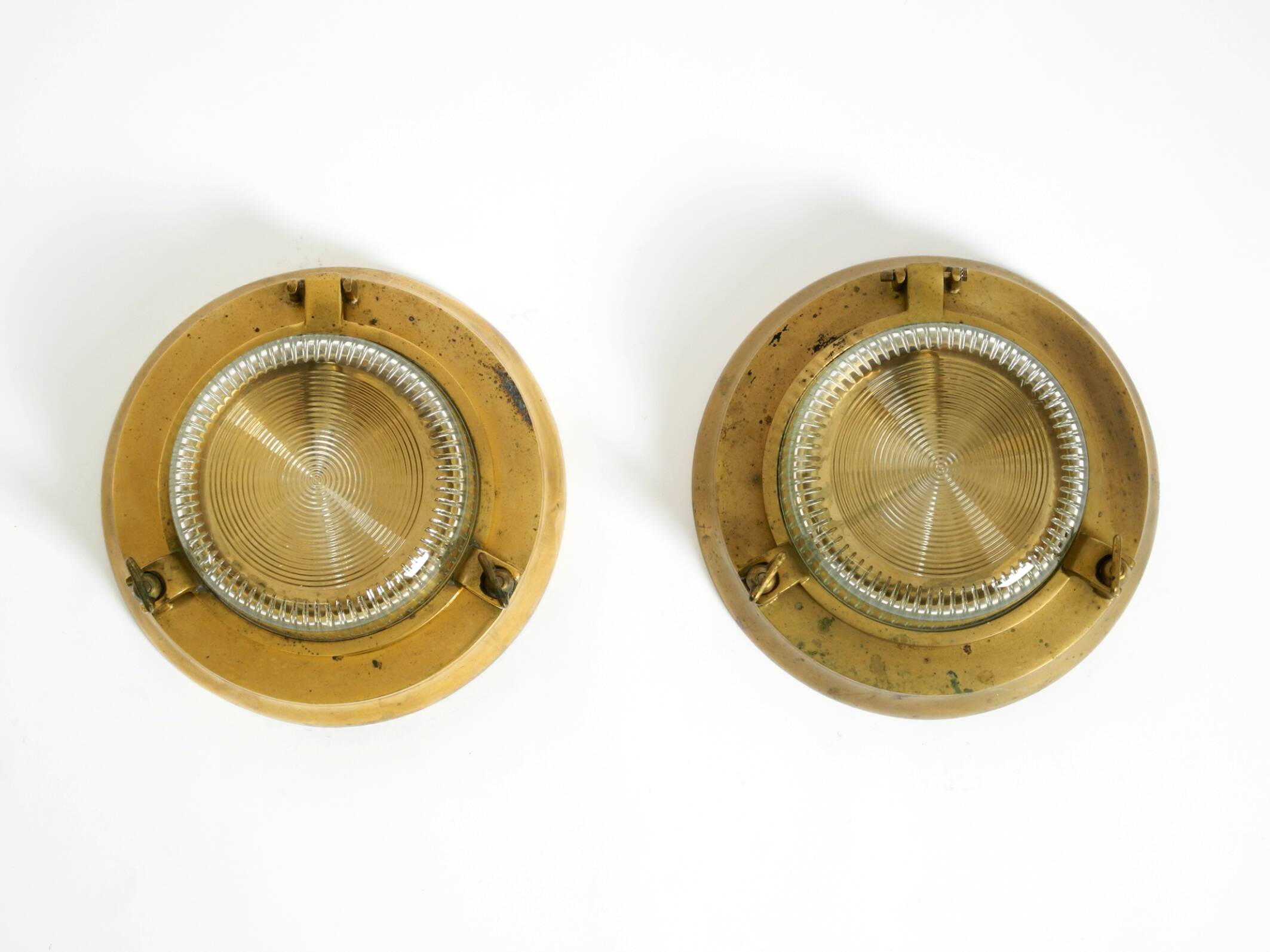 A pair of large, heavy 50s maritime ship wall lamps made of brass and glass