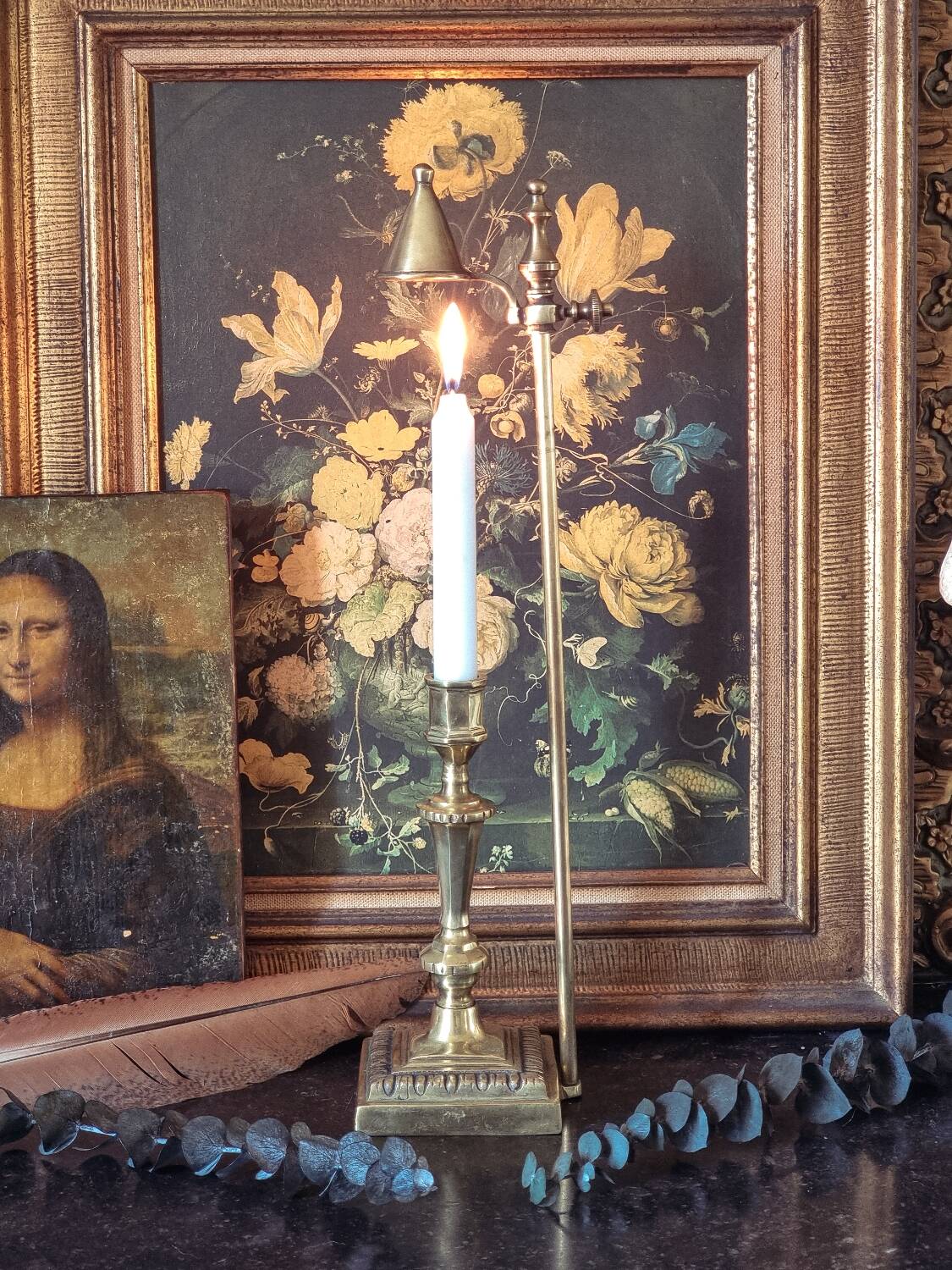 Candle holder with snuffer