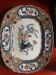 Large hollow dish in fine earthenware with Japanese decoration.