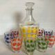 Liqueur service with multicoloured polka dot patterns.