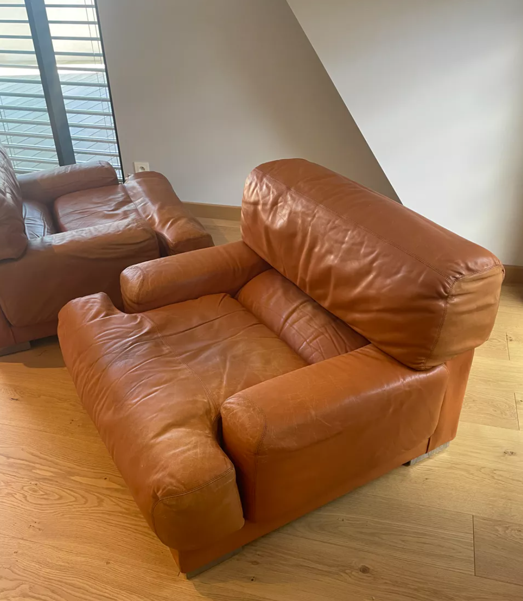 Pair of vintage armchairs Gérard Guermonprez tawny leather and stainless steel, France 1970