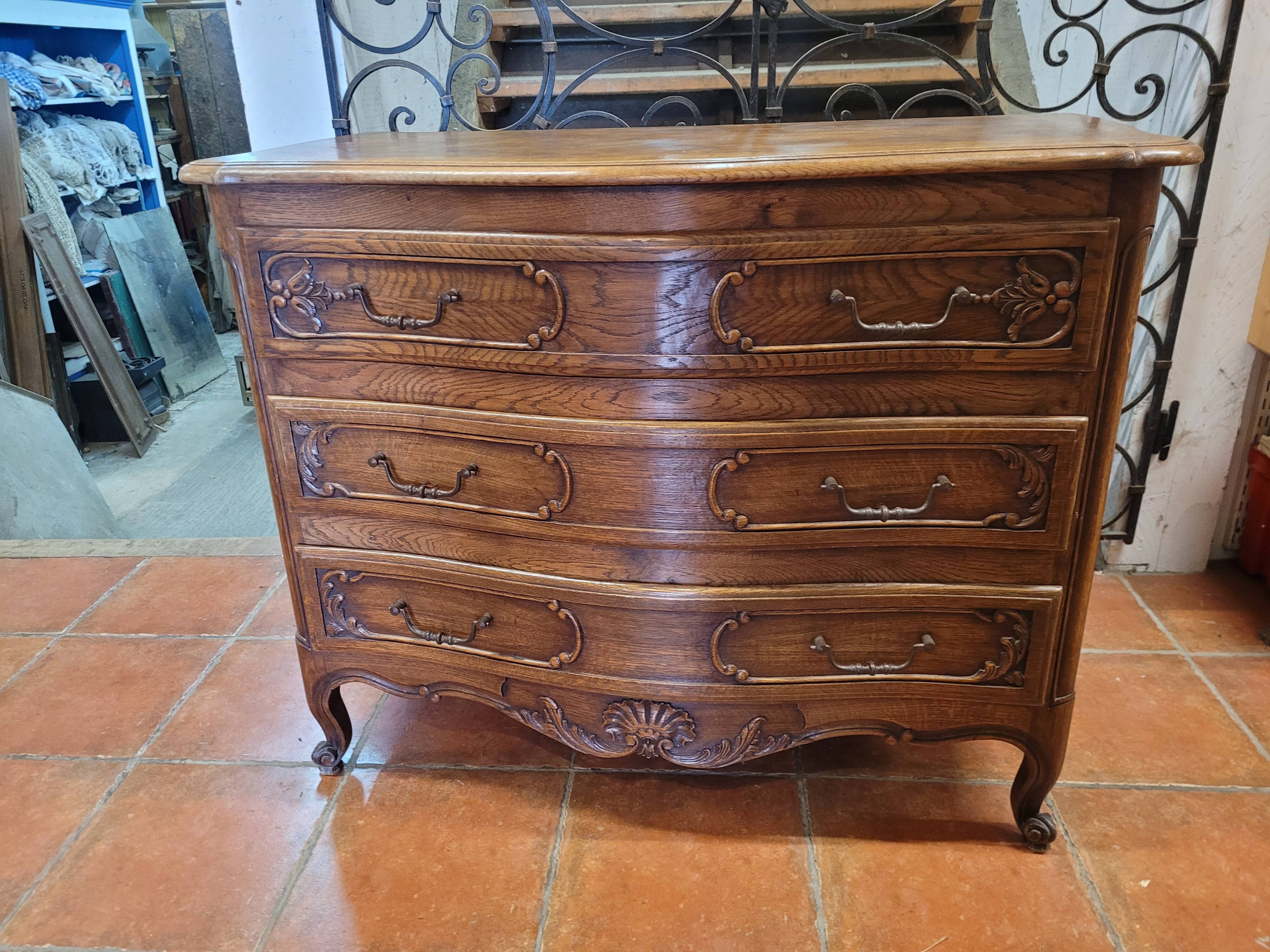 Curved oak chest of drawers in Louis XV style