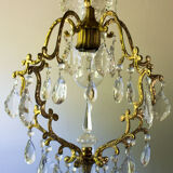 Old brass chandelier with glass stamps
