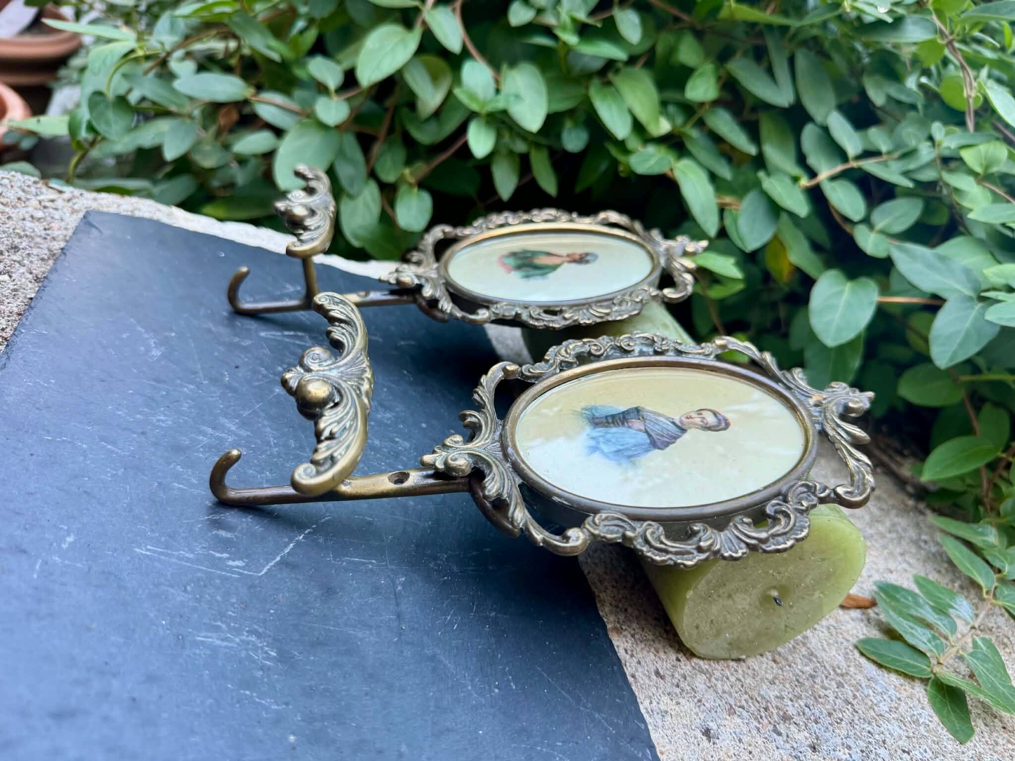 Pair of baroque brass coat hooks