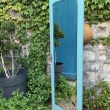 Beveled mirror on turquoise Parisian door