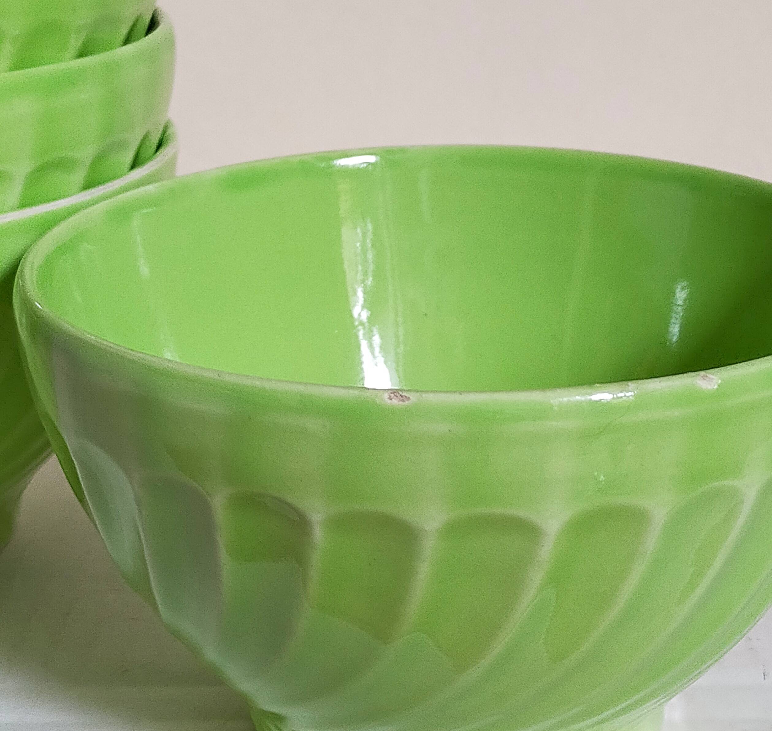 Four vintage spring green earthenware bowls