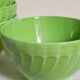 Four vintage spring green earthenware bowls