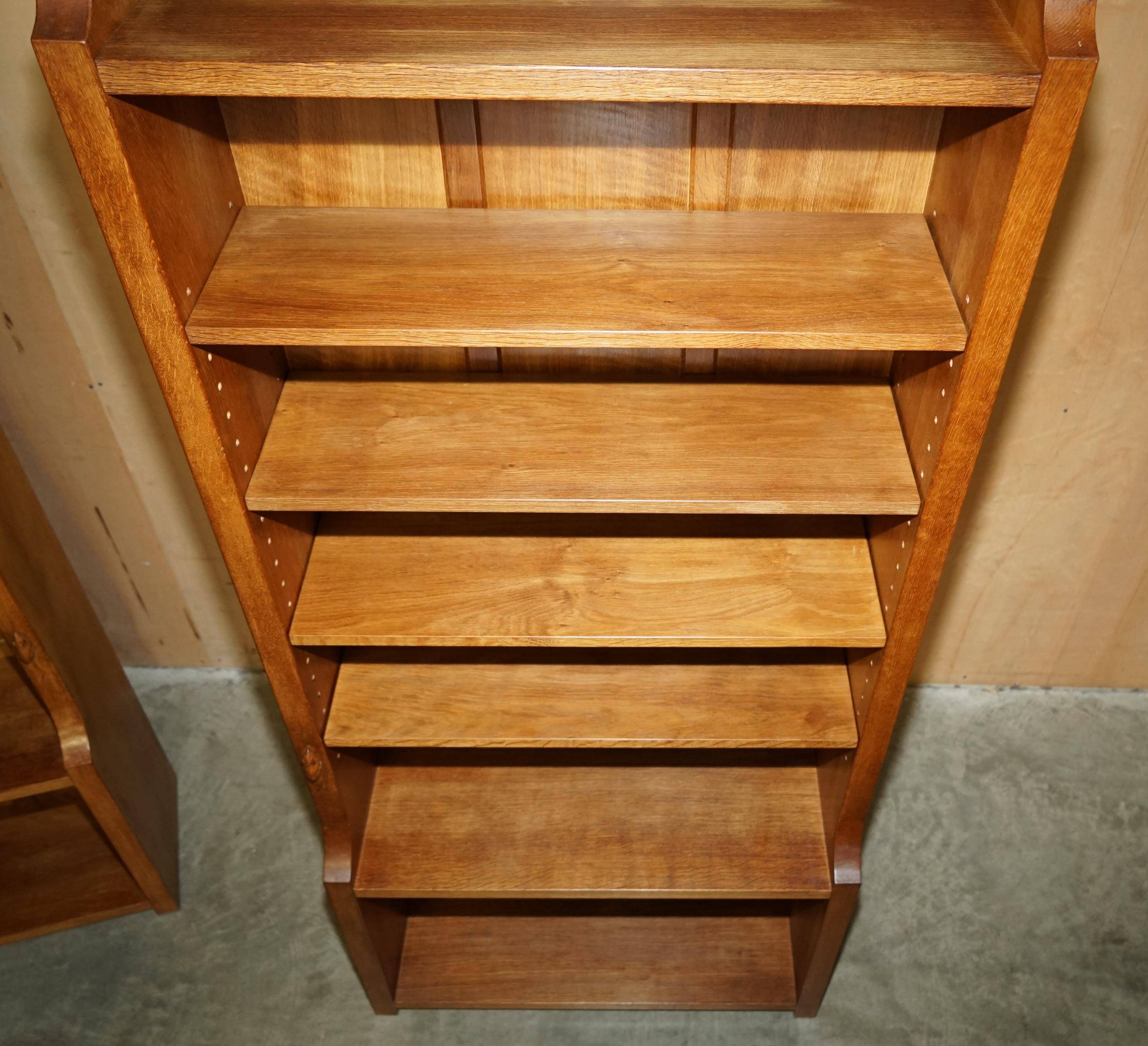 Pair of Robert Mouseman Thompson oak carved bookshelves.