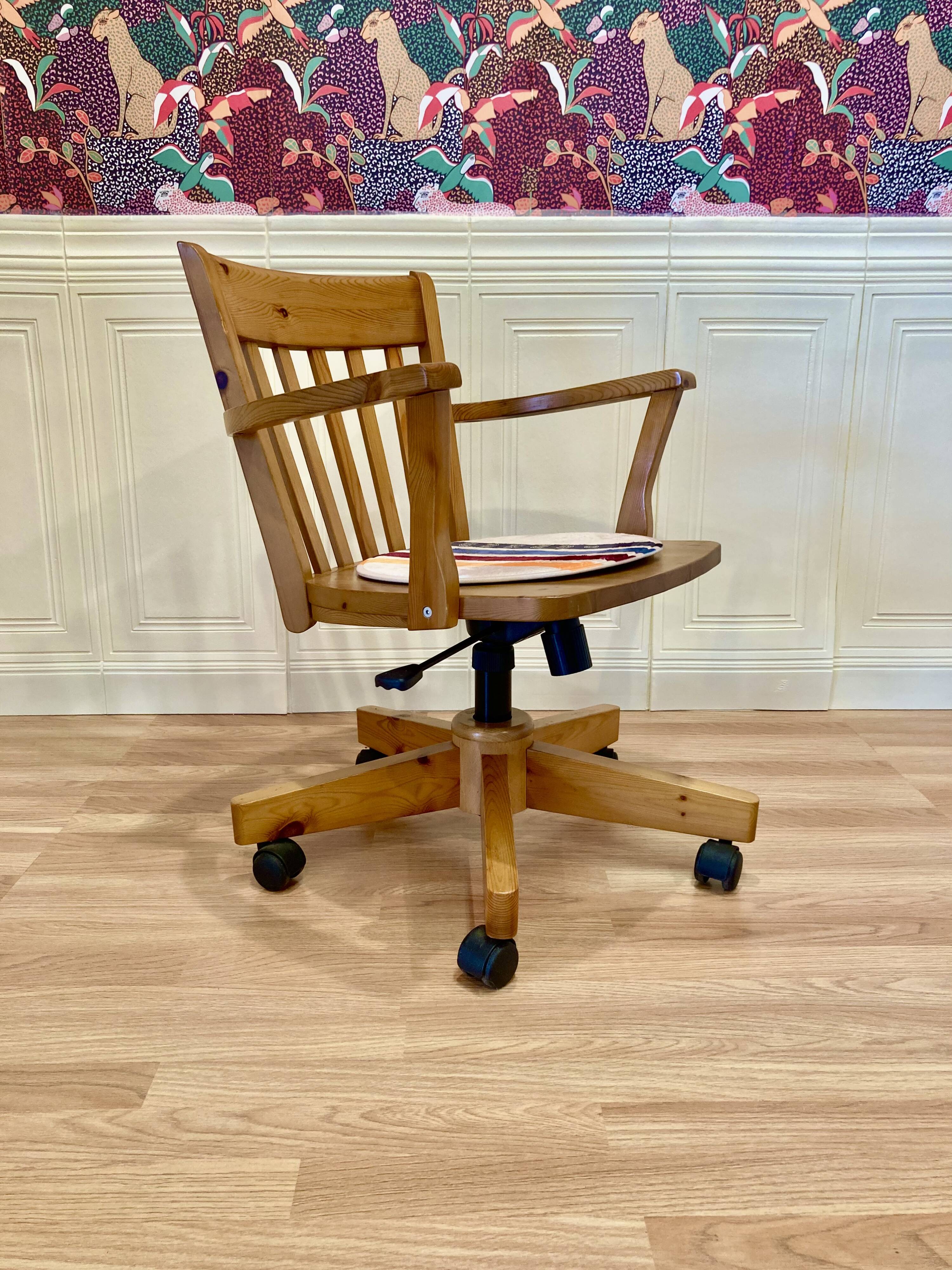 Solid wood swivel and reclining armchair.