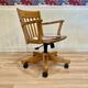 Solid wood swivel and reclining armchair.