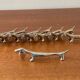 Series of 8 vintage Dachshund knife holders in silver metal