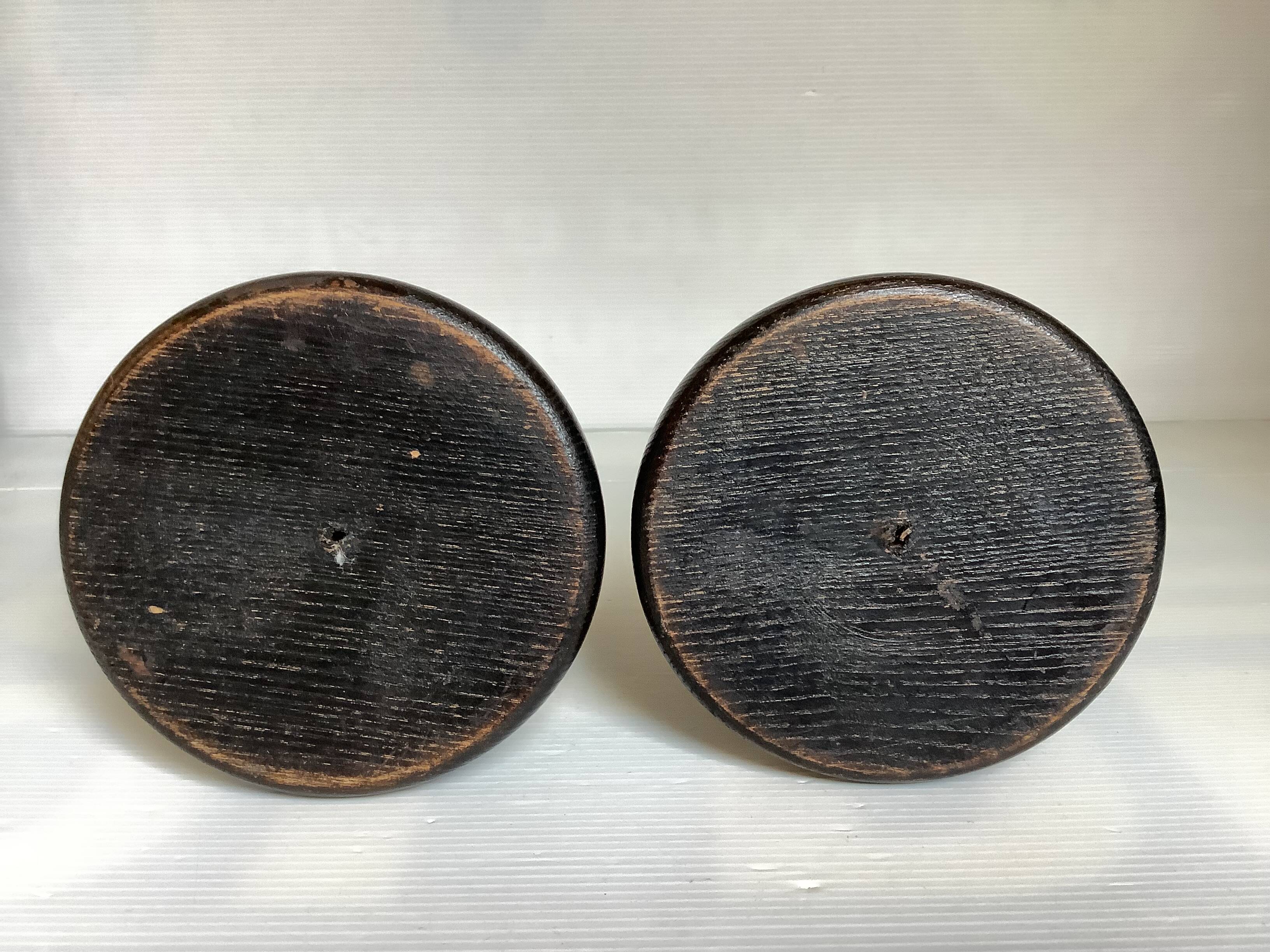 Pair of black stained wooden candlesticks