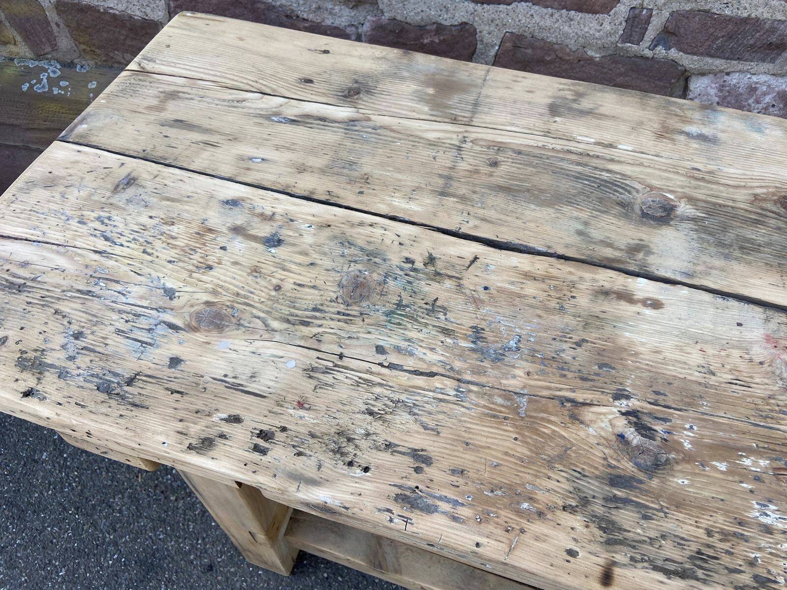 Primitive industrial table workbench in raw natural wood vintage bohemian trade store