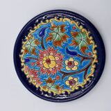 A flat bottom and two enamel bottle bottoms of Longwy