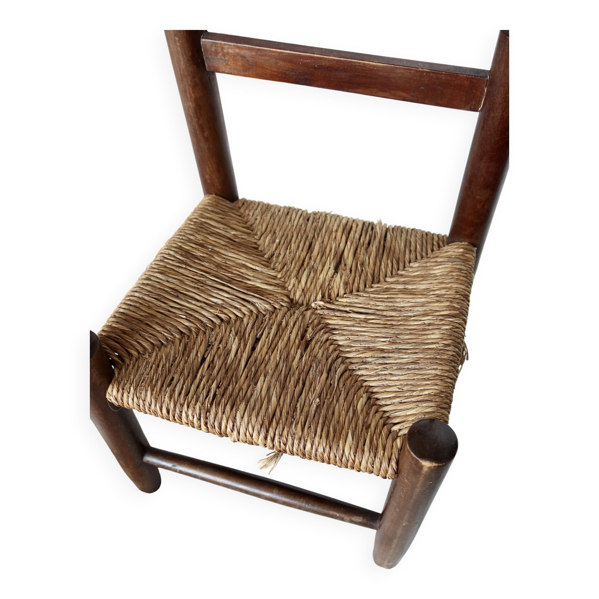 Vintage children's chair in dark wood with woven straw seat