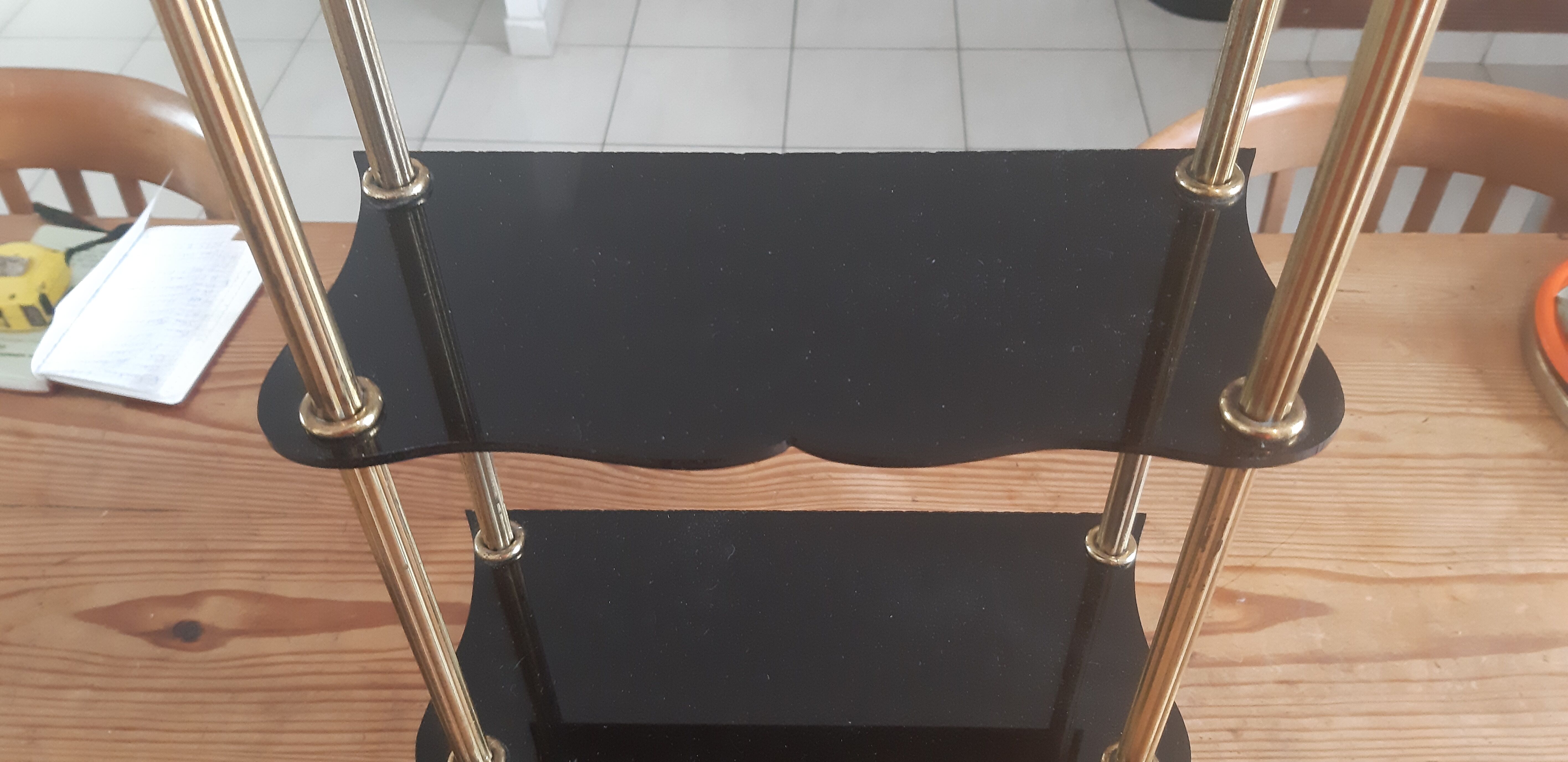 Vintage shelf of the 60s in golden metal and black plastic