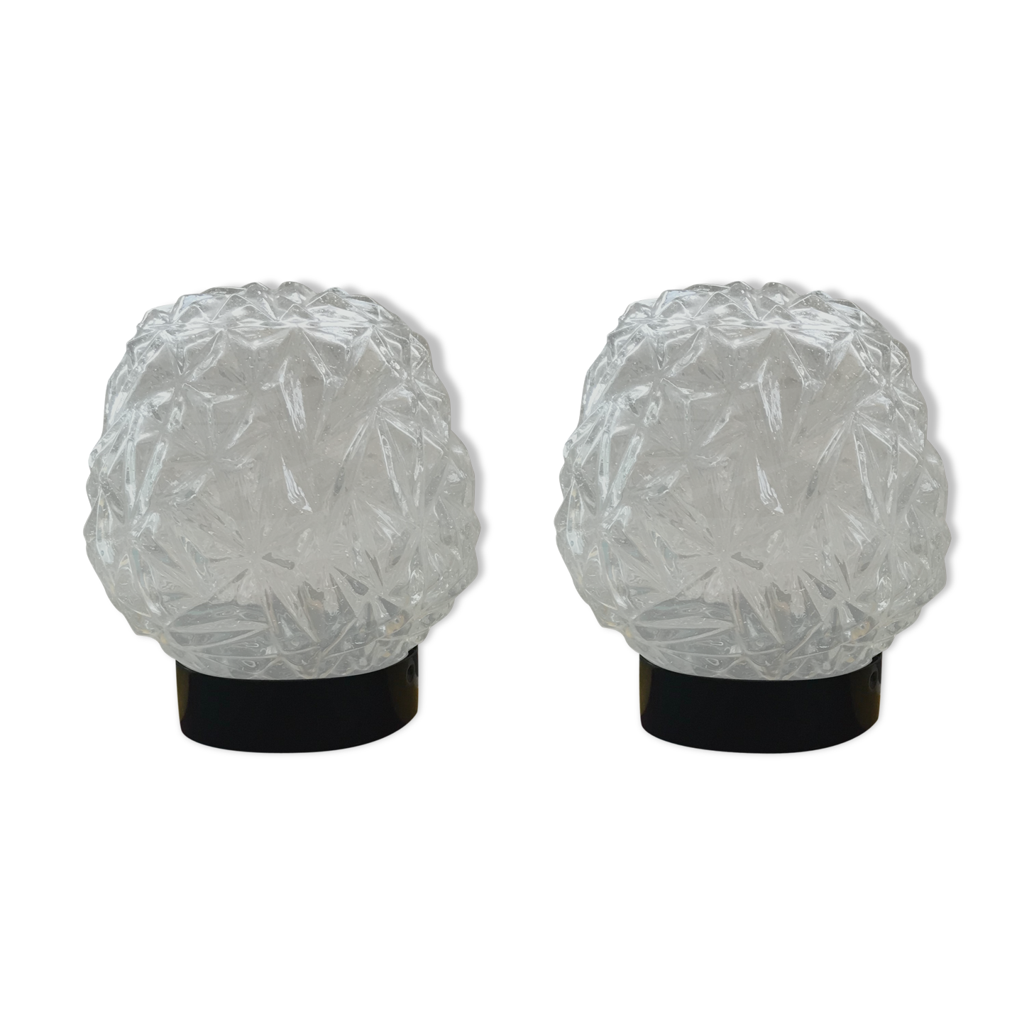 Old pair of glass moulded wall sconces with vintage black metal support