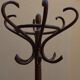 Curved wooden parrot coat holder
