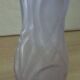 Frosted pressed glass vase with a light lilac medallion colour.